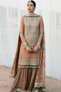 This ensemble is an absolute vibe with a tempting design on a beautiful base!  This beautiful party wear is designed in soft brown colour which is modern yet classy. The short shirt is adorned with silver embroidery which is further enhanced with tilla, dabka, kora, Kundan and the details of Zardozi. The beautiful tussles also hang on the bottom of the embellished neckline to make it a perfect choice for everyone Further, the floral patterns on full sleeves also intensify the charms of the outfit. It is coordinated with a sharara to balance the overall look. Complete this with a dupatta embellished with a four-sided border and floral jaal all over.