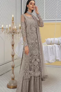 Chill vibes in grey are very rare. A beautiful grey shirt with a medley of hand-embellished floral motifs and floral patterns of silver embroidery which is highlighted with tilla, dabka, kora, Kundan and the real magic of Zardozi. The illusion neckline makes this party outfit a little romantic. Further, the floral patterns on full sleeves also add super beauty. It is paired up with plain jamawar trousers just to balance the look   Complete this gorgeous outfit with a dupatta in the same colour framed with four-sided borders and sequins sprayed all over. 