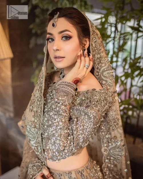 A dreamy statement of brown nikah outfit! This dress proffers a brown hue with its glamorous silver embroidery. The handsome