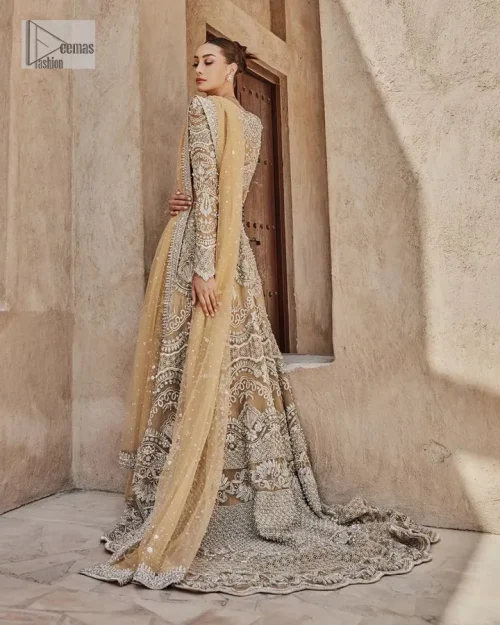 Bold, edgy, and wrapped in glamour. A sumptuous palette of gold with silver delicate embroidery, signature handcrafted embellishment includes tilla,