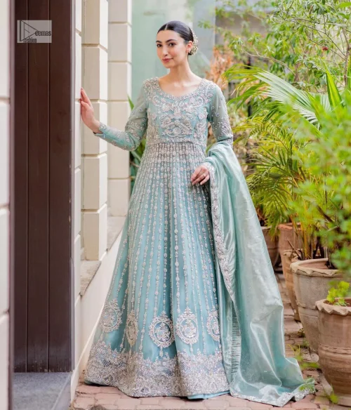 This attire showcases a harmonious fusion of traditional and modern design elements, adorned with intricate silver embellishments that include tilla,
