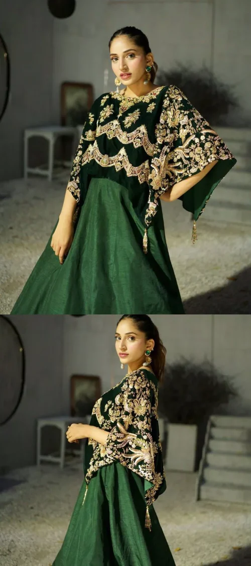 Style. Warmth. Performance & versatility!  This stuns in a beautifully handcrafted green top enshrined with light golden embellishment and detailed