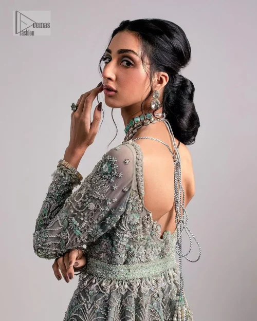 The beautiful mint green reception wear is a breathtaking masterpiece that will give you a magnificent look at the wedding.
