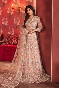 The beautiful outfit comes has an alluring peach colour and is gracefully emblazoned with embroidery. Hand-crafted details of tilla, dabka, kora, Kundan, stones, motifs, and sequins enhance the charm of this outfit. The sweetheart neckline makes this blouse a little more romantic for your walima day. Further, the floral motifs on half sleeves are just a new trend of looming on your day. It is organized with a heavy lehenga. Beaming silver work, floral designs, and lavish details give a perfect finishing look to the masterpiece. Complete this attire with a dupatta framed with a four-sided borders and floral motifs all over.