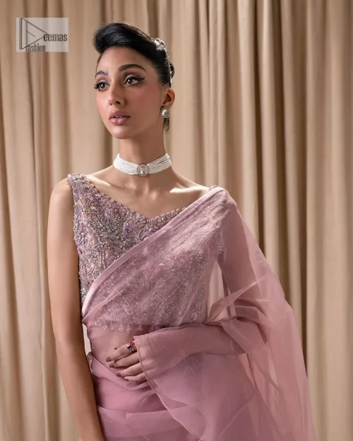 Turn heads in our stunning bridesmaid saree! The beautiful tea pink blouse is adorned with silver and golden embroidery which