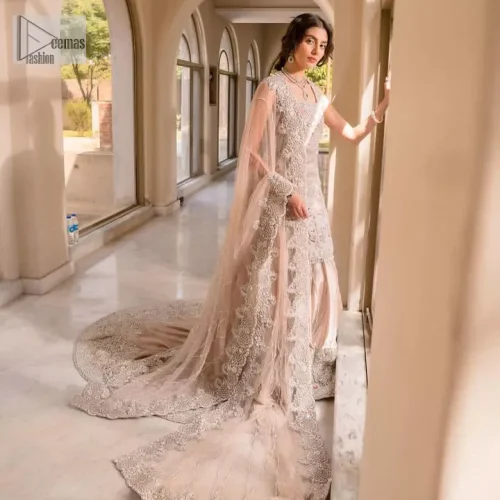 The beauty of idealism is captured with a touch of sparkle. This exclusive rose pink ensemble is beautifully translated on