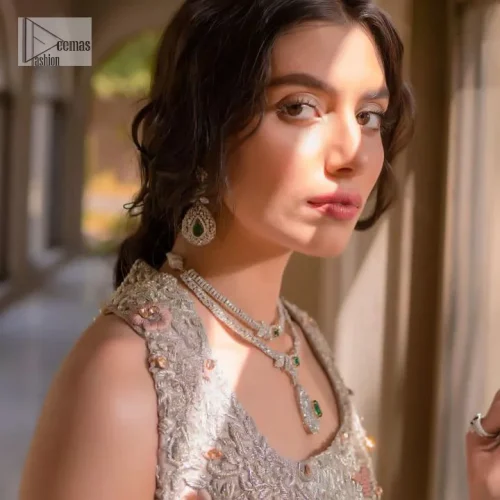 The beauty of idealism is captured with a touch of sparkle. This exclusive rose pink ensemble is beautifully translated on