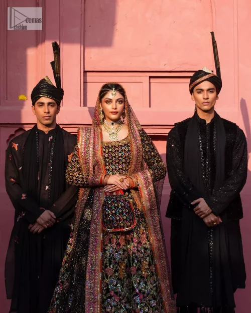 Make your superb days bright and bold! A jet black blouse with floral branches, peacock motifs and Mughal-inspired embellishments with