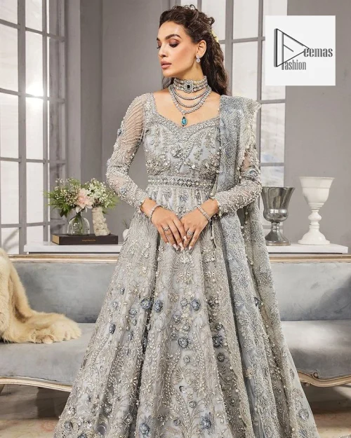 Awe-inspiring embellishments on luxurious Gray canvas for an ultra-bride look on nikkah. A Gray flared maxi, heavily hand embellished with