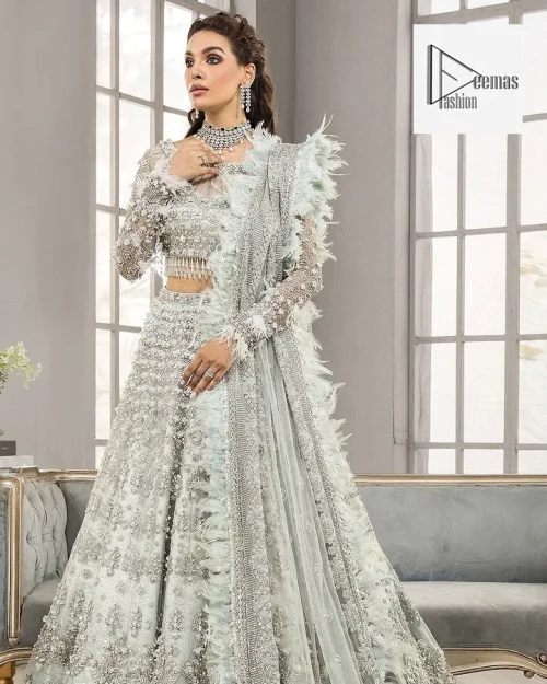 Complete this article with a dupatta framed with four-sided embellished borders and floral motifs all over.