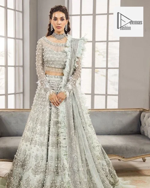 Its boat-shaped neckline and full sleeves ensure comfort and confidence as you celebrate your special occasion.