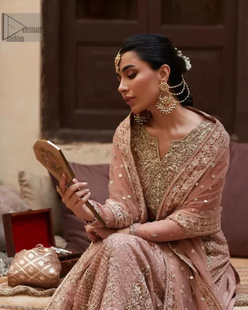 It is paired up with a dupatta having four sides embellished border.