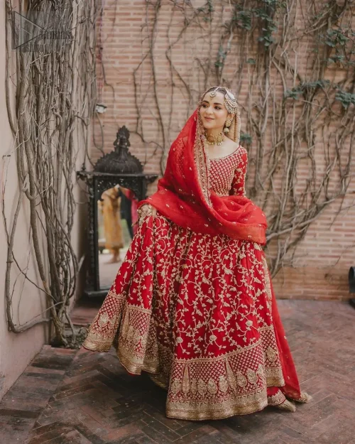 This unique dress is a masterpiece of design that involves light golden and bosky shades of embroidery having tilla, dabka,