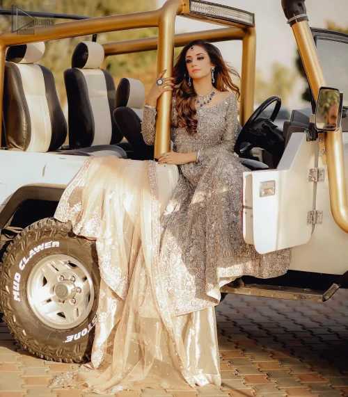 The Fawn Back Train Maxi Dupatta envelops you in sheer luxury and grace, creating a celestial aura for your Nikah