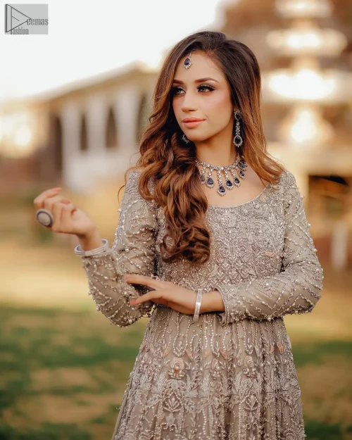 The Fawn Back Train Maxi Dupatta envelops you in sheer luxury and grace, creating a celestial aura for your Nikah