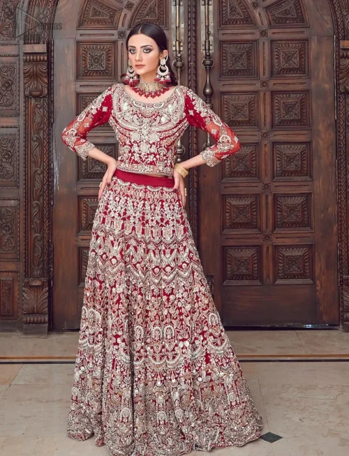 Embrace timeless allure with the Maroon Wide Flared Lehenga Blouse, an exquisite choice for your wedding celebration. Maroon Wide Flared
