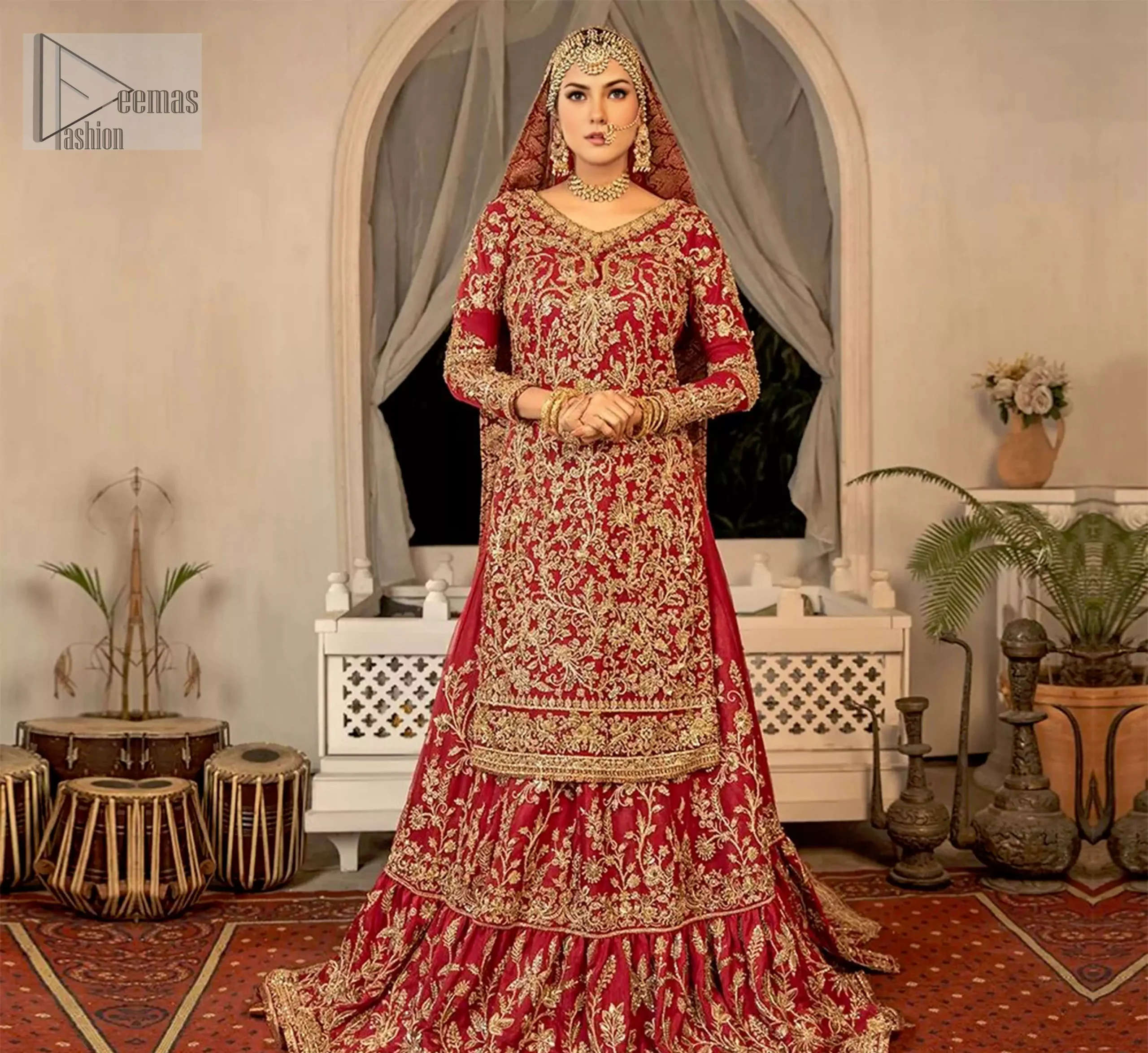 The long-length shirt, with a V-neckline and full sleeves, creates a sleek and elegant silhouette, while the back train of the lehenga flows behind you like a regal veil.
