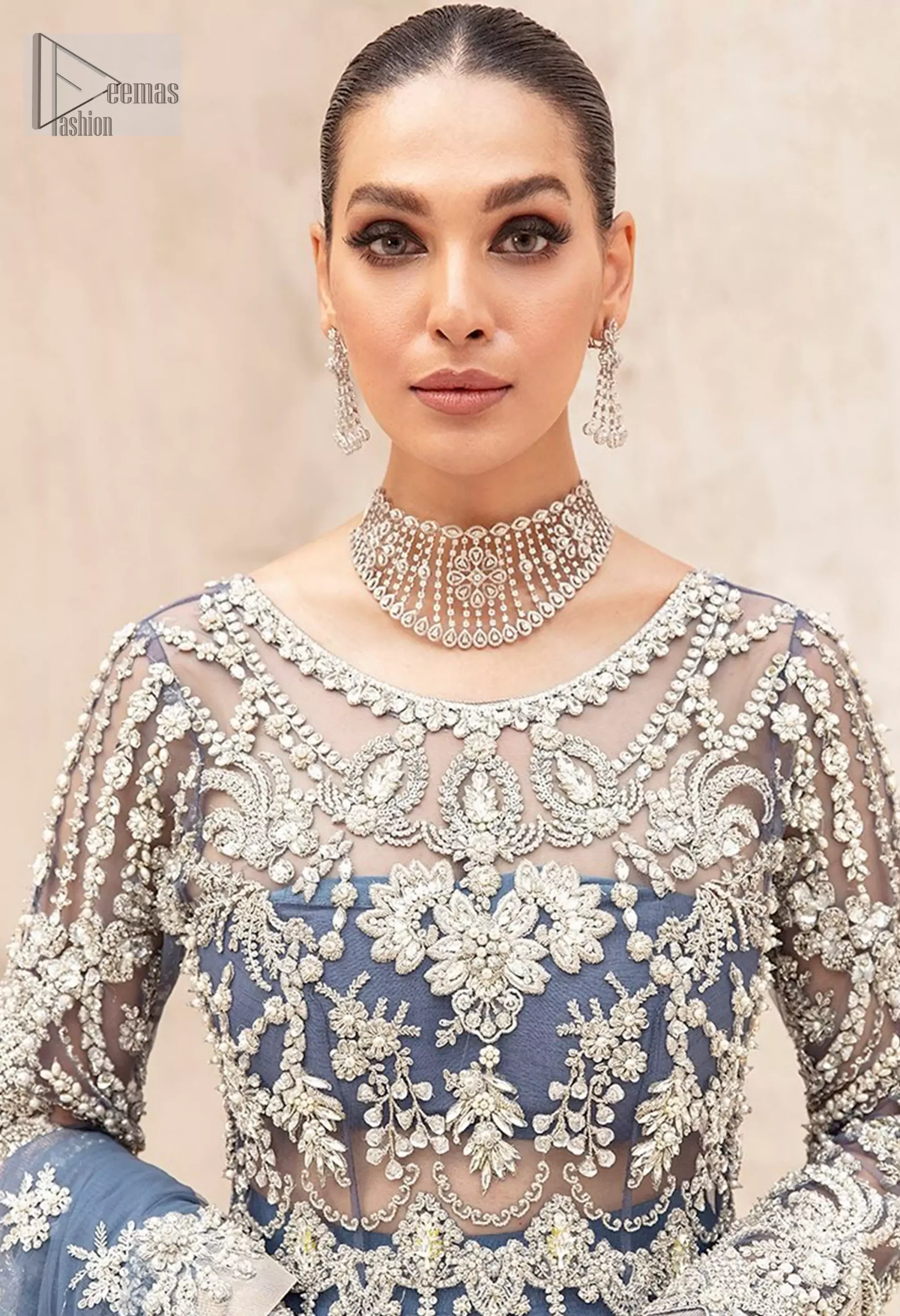 The full sleeves and round neckline create a timeless silhouette, while the dupatta’s graceful scalloped edges add a subtle touch of sparkle.