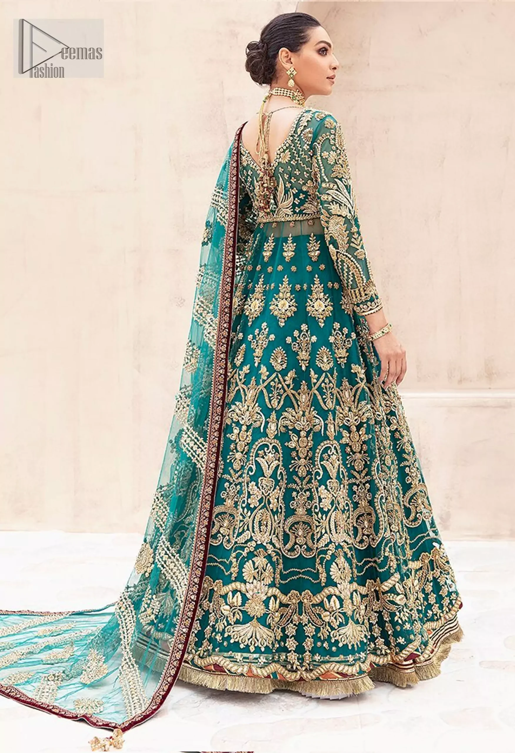 The embellished bodice glitters under the light, while the delicate chatta patti on the hem adds artistry. The lehenga’s voluminous Can-Can layers create a graceful silhouette finished with kiran lace.