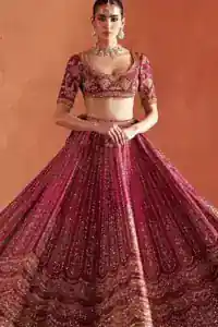 Waistline Precision: The fixed waist belt of the crimson lehenga, illustrating the secure side zip closure and tailored fit.