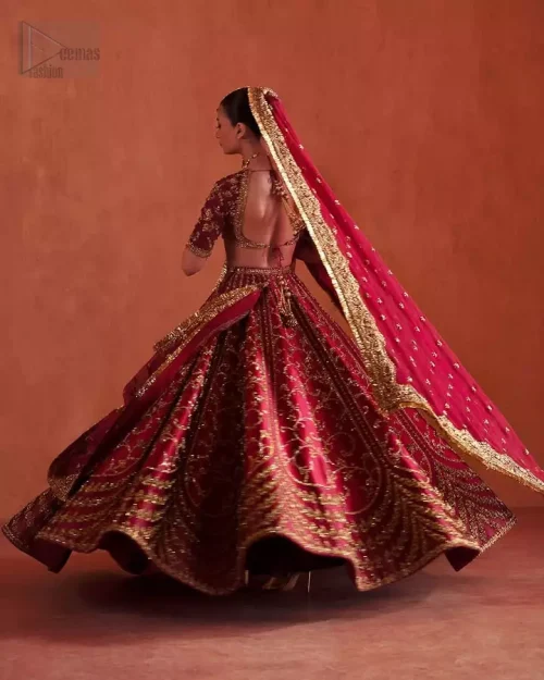 Wide Flare Perspective: Capturing the majestic wide flare of the deep fuchsia raw silk lehenga, showcasing its effortless charisma and