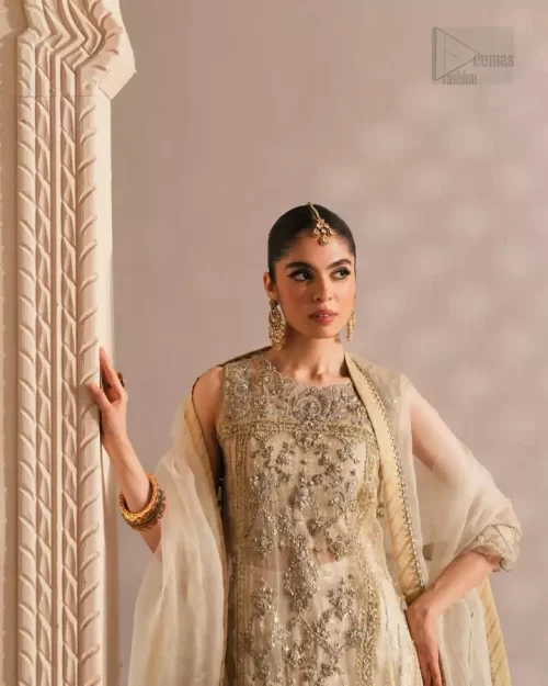 Timeless ivory sharara set with intricate handwork and a silhouette designed for understated elegance