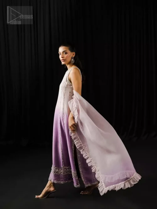 Sleeveless halterneck silk shirt in lavender and mauve with light embellishment, styled with straight trousers and airy dupatta.